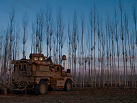 A U.S. Army Mine Resistance Ambushed Protected vehicle from Bravo Company, 48th Brigade stands guard as part of the cordon surrounding Ghabi Khail village Dec. 17, 2009 (Photo: ResoluteSupportMedia, Flickr, CC BY 2.0).