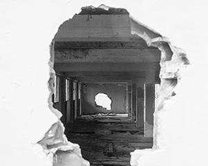 View through destroyed buildings in black and white