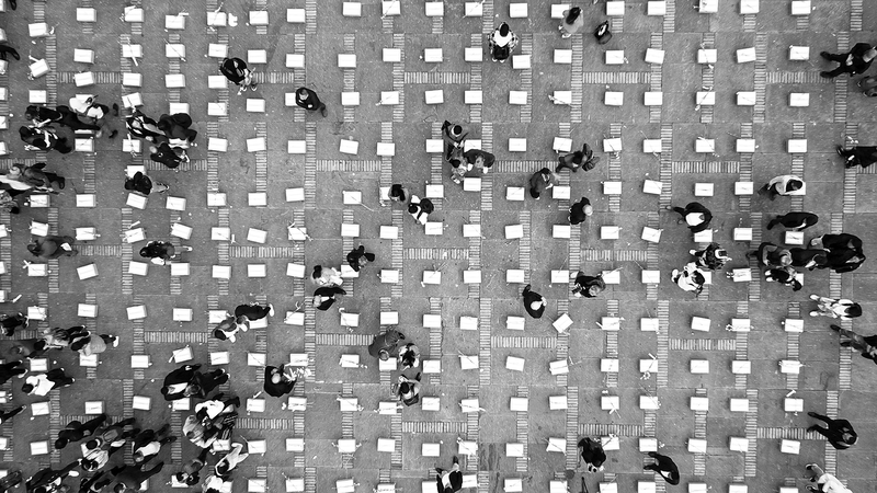 Picture description: People are gathering and placing flowers on cardboard boxes that symbolize coffins during a demonstration against the assassinations of peace signatories and social leaders at Bolivar Square in Bogotá, Colombia, on February 20, 2024.