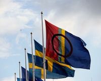 Sami Flag in front of the Swedish national flag